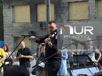 Musicians of the Kyiv Classic Orchestra are performing during the requiem for the victims of the Russian missile attack on the Ohmatdyt Nati...