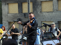 Musicians of the Kyiv Classic Orchestra are performing during the requiem for the victims of the Russian missile attack on the Ohmatdyt Nati...