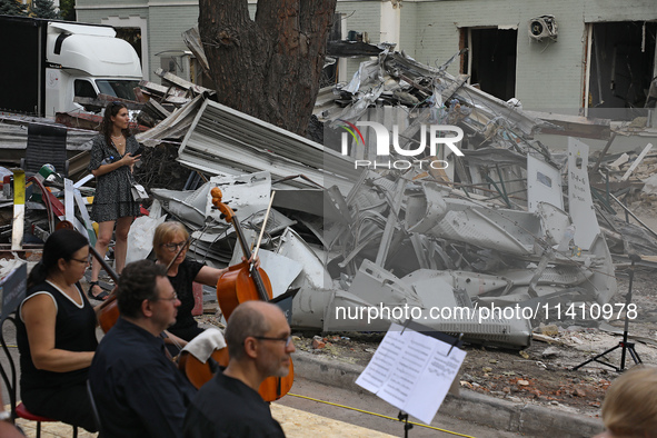 Musicians of the Kyiv Classic Orchestra are performing during the requiem for the victims of the Russian missile attack on the Ohmatdyt Nati...