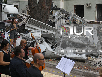 Musicians of the Kyiv Classic Orchestra are performing during the requiem for the victims of the Russian missile attack on the Ohmatdyt Nati...