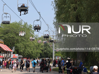 People are enjoying the skyride on Centre Island in Toronto, Ontario, Canada, on July 13, 2024. (