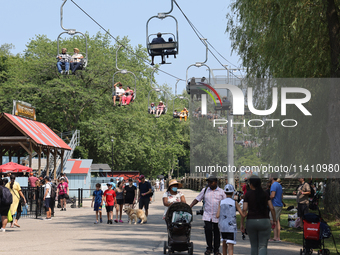 People are enjoying the skyride on Centre Island in Toronto, Ontario, Canada, on July 13, 2024. (