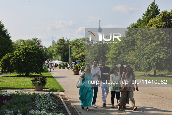 The CN Tower is appearing above the treetops from Centre Island in Toronto, Ontario, Canada, on July 13, 2024. 