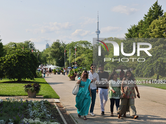 The CN Tower is appearing above the treetops from Centre Island in Toronto, Ontario, Canada, on July 13, 2024. (