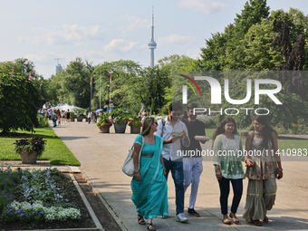 The CN Tower is appearing above the treetops from Centre Island in Toronto, Ontario, Canada, on July 13, 2024. (