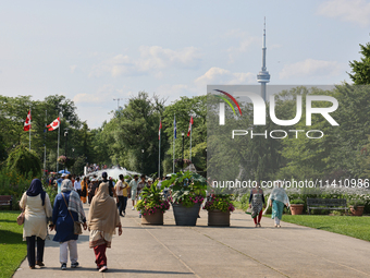 The CN Tower is appearing above the treetops from Centre Island in Toronto, Ontario, Canada, on July 13, 2024. (