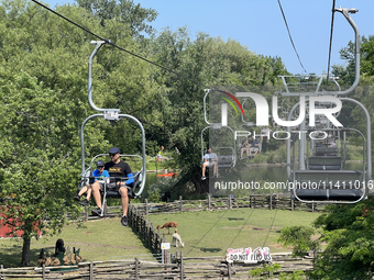 People are enjoying the skyride on Centre Island in Toronto, Ontario, Canada, on July 13, 2024. (