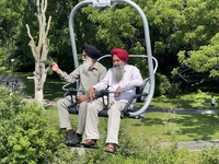 Elderly Sikh men are enjoying the skyride on Centre Island in Toronto, Ontario, Canada, on July 13, 2024. (