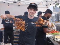 A man is grilling Syrian Aleppo-style kabobs during the Taste of the Middle East Food Festival in Toronto, Ontario, Canada, on July 06, 2024...