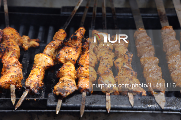 Syrian Aleppo style kabobs are grilling during the Taste of the Middle East Food Festival in Toronto, Ontario, Canada, on July 06, 2024. The...