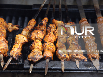 Syrian Aleppo style kabobs are grilling during the Taste of the Middle East Food Festival in Toronto, Ontario, Canada, on July 06, 2024. The...