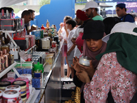 A woman is looking at beauty products from Dubai during the Taste of the Middle East Food Festival in Toronto, Ontario, Canada, on July 06,...