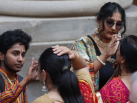 Tikkas are being applied to the foreheads of devotees as thousands of Hindu devotees are taking part in the procession during the annual Rat...