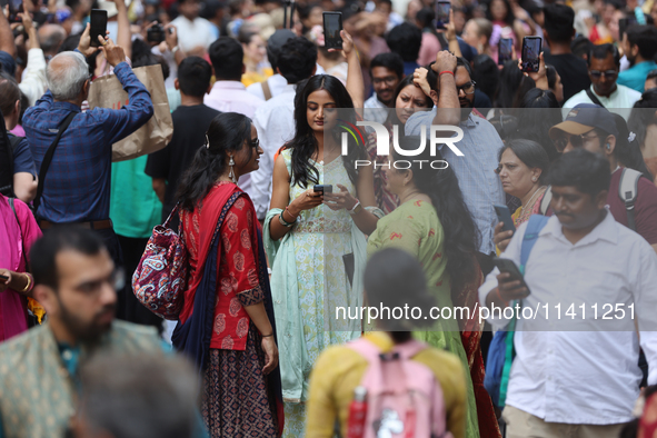 Thousands of Hindu devotees are taking part in the procession during the annual Rath Yatra festival in Toronto, Ontario, Canada, on July 13,...