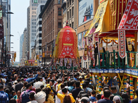 Thousands of Hindu devotees are taking part in the chariot procession as they escort the chariots carrying the deities during the annual Rat...