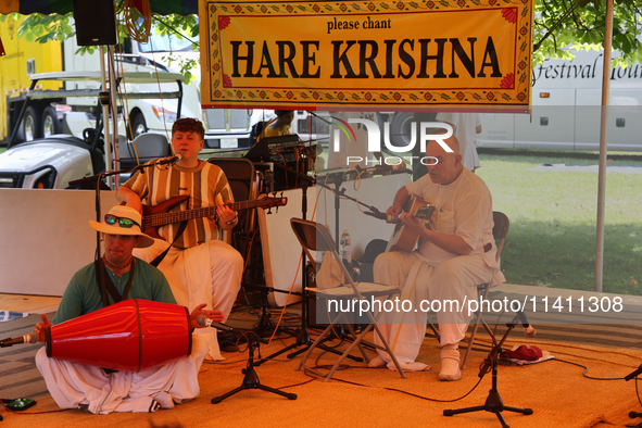 Hindu devotees are singing kirtans during the annual Rath Yatra festival in Toronto, Ontario, Canada, on July 13, 2024. The Rath Yatra festi...