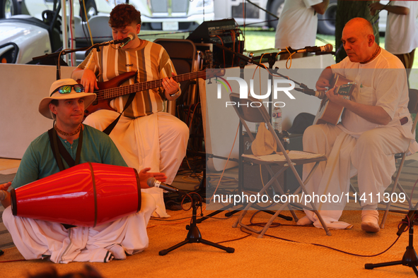 Hindu devotees are singing kirtans during the annual Rath Yatra festival in Toronto, Ontario, Canada, on July 13, 2024. The Rath Yatra festi...