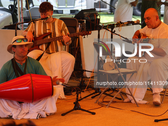 Hindu devotees are singing kirtans during the annual Rath Yatra festival in Toronto, Ontario, Canada, on July 13, 2024. The Rath Yatra festi...