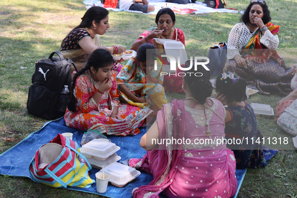 Hindu devotees are picnicking on Centre Island during the annual Rath Yatra festival in Toronto, Ontario, Canada, on July 13, 2024. The Rath...