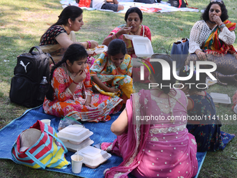 Hindu devotees are picnicking on Centre Island during the annual Rath Yatra festival in Toronto, Ontario, Canada, on July 13, 2024. The Rath...