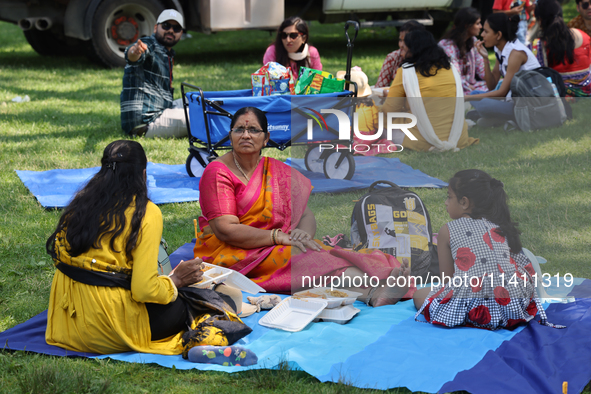 Hindu devotees are picnicking on Centre Island during the annual Rath Yatra festival in Toronto, Ontario, Canada, on July 13, 2024. The Rath...