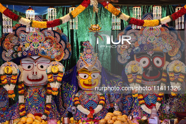 Idols of Goddesses Subhadra, Balabhadra, and Lord Jagannath are being decorated during the annual Rath Yatra festival in Toronto, Ontario, C...