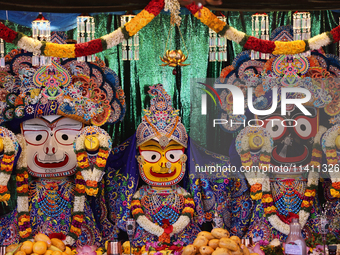 Idols of Goddesses Subhadra, Balabhadra, and Lord Jagannath are being decorated during the annual Rath Yatra festival in Toronto, Ontario, C...