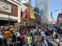 Thousands of Hindu devotees are taking part in the chariot procession as they escort the chariots carrying the deities during the annual Rat...