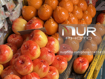 Fancy candles in the shape of fruit are being displayed at a small shop in Nainital, Uttarakhand, India, on April 21, 2024. (