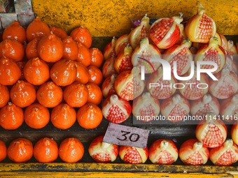 Fancy candles in the shape of fruit are being displayed at a small shop in Nainital, Uttarakhand, India, on April 21, 2024. (