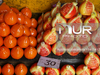 Fancy candles in the shape of fruit are being displayed at a small shop in Nainital, Uttarakhand, India, on April 21, 2024. (