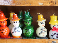 Fancy candles in the shape of snowmen are being displayed at a small shop in Nainital, Uttarakhand, India, on April 21, 2024. (