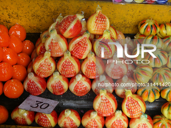 Fancy candles in the shape of fruit are being displayed at a small shop in Nainital, Uttarakhand, India, on April 21, 2024. (