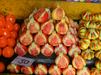 Fancy candles in the shape of fruit are being displayed at a small shop in Nainital, Uttarakhand, India, on April 21, 2024. (