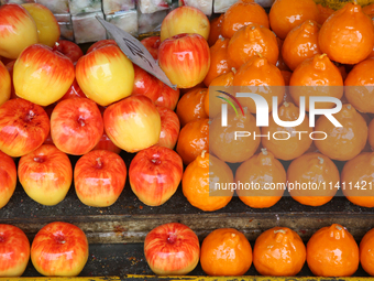 Fancy candles in the shape of fruit are being displayed at a small shop in Nainital, Uttarakhand, India, on April 21, 2024. (