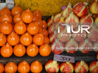 Fancy candles in the shape of fruit are being displayed at a small shop in Nainital, Uttarakhand, India, on April 21, 2024. (