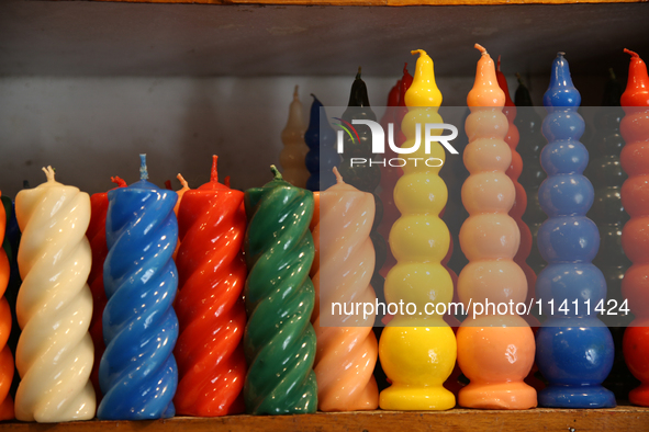 Candles are being displayed at a small shop in Nainital, Uttarakhand, India, on April 21, 2024. 