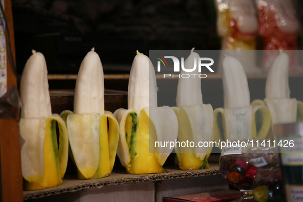 Fancy candles in the shape of bananas are being displayed at a small shop in Nainital, Uttarakhand, India, on April 21, 2024. 