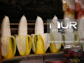 Fancy candles in the shape of bananas are being displayed at a small shop in Nainital, Uttarakhand, India, on April 21, 2024. (