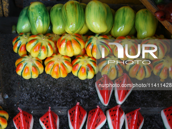 Fancy candles in the shape of fruit are being displayed at a small shop in Nainital, Uttarakhand, India, on April 21, 2024. (