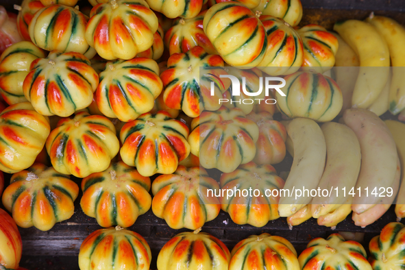 Fancy candles in the shape of fruit are being displayed at a small shop in Nainital, Uttarakhand, India, on April 21, 2024. 