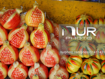 Fancy candles in the shape of fruit are being displayed at a small shop in Nainital, Uttarakhand, India, on April 21, 2024. (