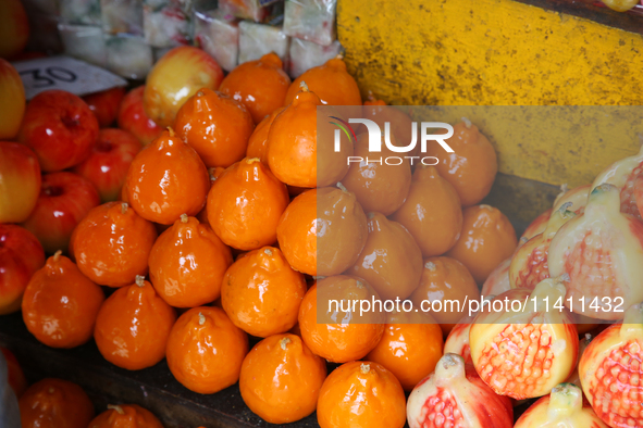 Fancy candles in the shape of fruit are being displayed at a small shop in Nainital, Uttarakhand, India, on April 21, 2024. 