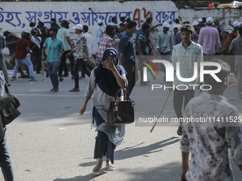 An unidentified student is fleeing during a clash between BCL members and Quota Student Protesters in Dhaka, Bangladesh, on July 15, 2024. (