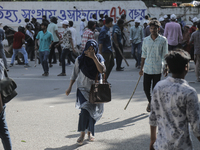 An unidentified student is fleeing during a clash between BCL members and Quota Student Protesters in Dhaka, Bangladesh, on July 15, 2024. (