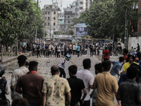 A BCL member and a Quota Student protester are clashing in Dhaka, Bangladesh, on July 15, 2024. (