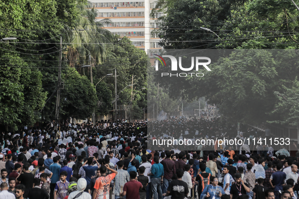 Smoke is rising after a crude bomb is exploding during a clash between BCL and student protestors in Dhaka, Bangladesh, on July 15, 2024. 