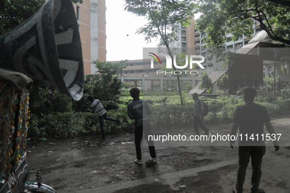 Quota student protesters are throwing rocks at a dormitory of Dhaka University where BCL members are present in Dhaka, Bangladesh, on July 1...