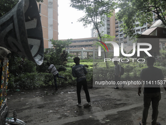 Quota student protesters are throwing rocks at a dormitory of Dhaka University where BCL members are present in Dhaka, Bangladesh, on July 1...