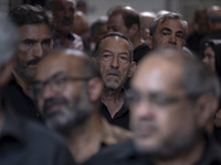 An elderly Iranian man is looking on while waiting to receive a donated meal, during a religious festival to commemorate Tasoua, a day ahead...